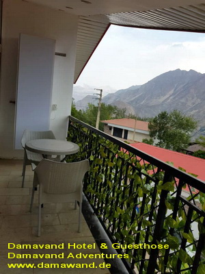 Scenic terrace of the hotel with stunning mountain and nature views near Damavand Beautiful hotel terrace with mountain view near Mount Damavand on a sunny day